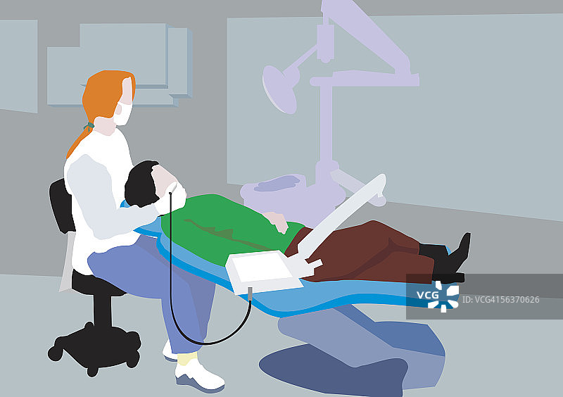 正在为病人进行治疗的牙医图片素材