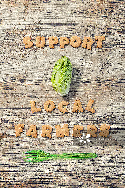 用饼干拼写的支持本地农民标语图片素材