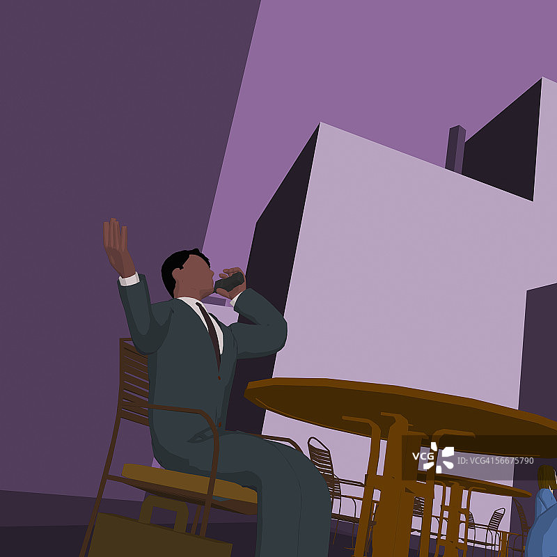 低角度拍摄：商务男士用无绳电话交谈图片素材