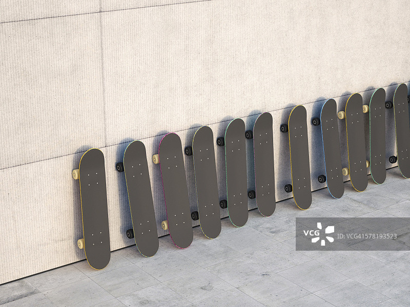 靠在混凝土墙上的一排滑板，3D渲染图片素材
