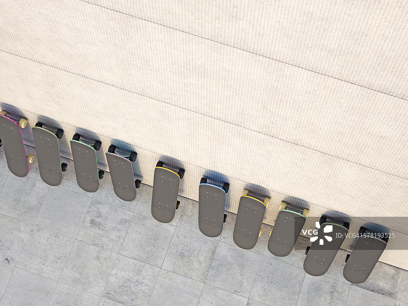 靠在混凝土墙上的一排滑板，3D渲染图片素材