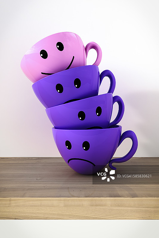 堆叠的笑脸杯和不开心杯子图片素材