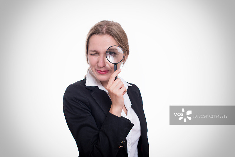 拿着放大镜的女人图片素材