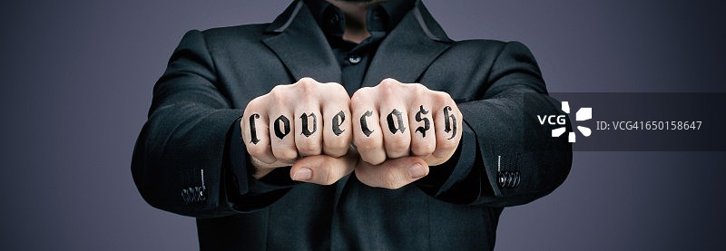 有纹身的商人拳头图片素材