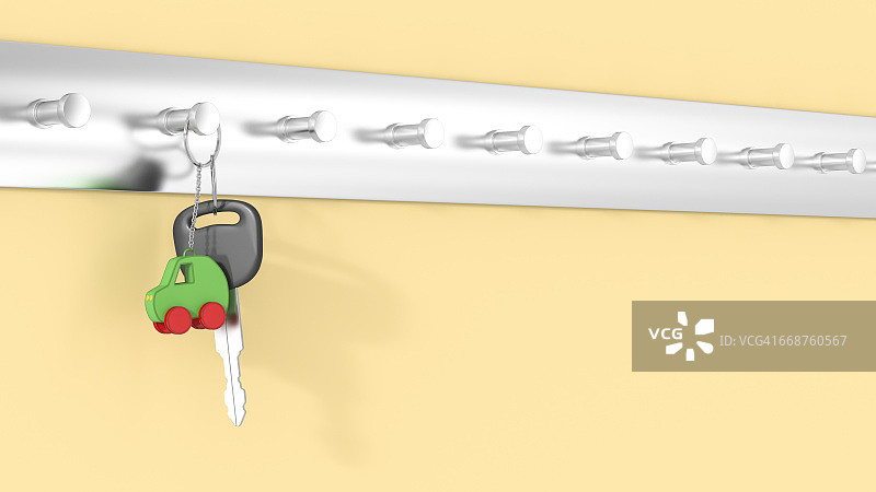 挂在钥匙钩上的带钥匙圈的汽车钥匙，电动汽车图片素材