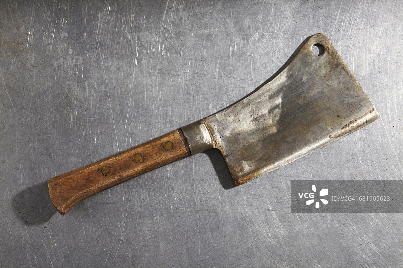 不锈钢表面上的切肉刀图片素材