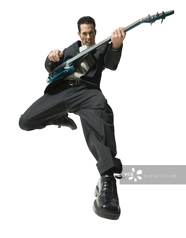 仰视：弹吉他的商人图片素材