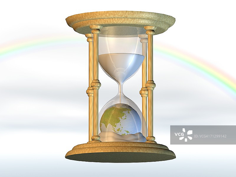 沙漏中沙子落在地球仪上的特写图片素材