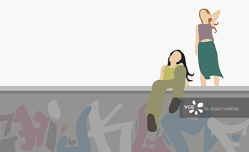 低角度拍摄的年轻女人坐在墙上图片素材