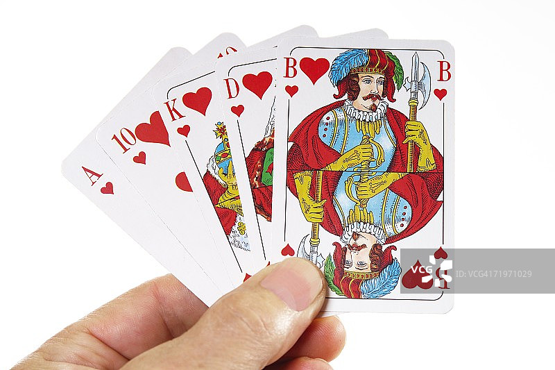 手持红桃同花顺的人图片素材