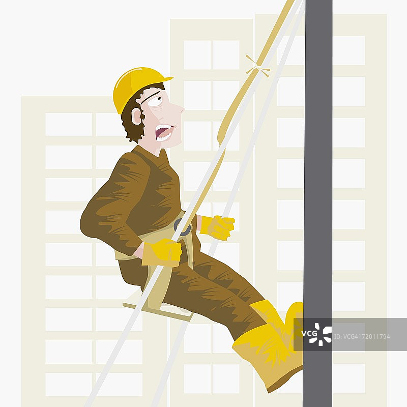 建筑工人查看安全带断裂绳索的特写图片素材