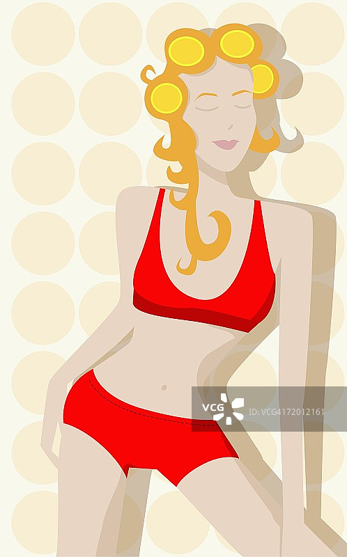 戴卷发器的年轻女人特写图片素材