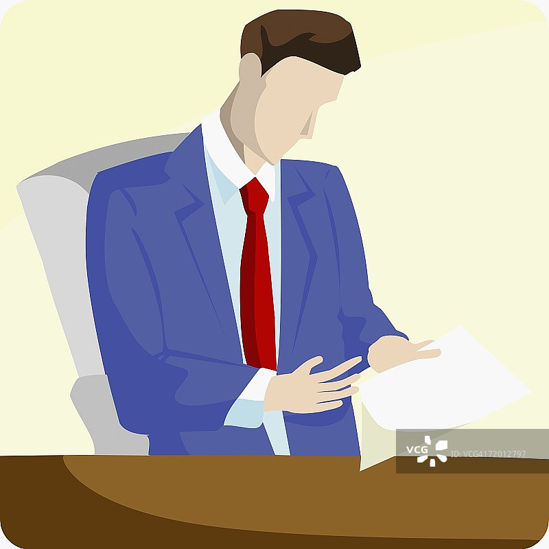 商人坐在办公室里阅读文件图片素材