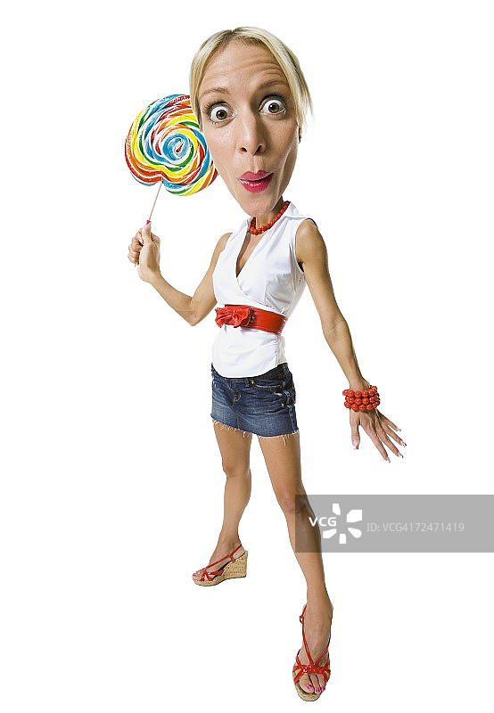 手持棒棒糖的年轻女子肖像图片素材