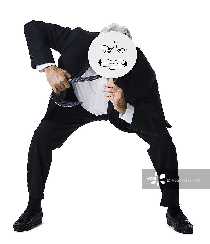 手持坚定面具的商人图片素材