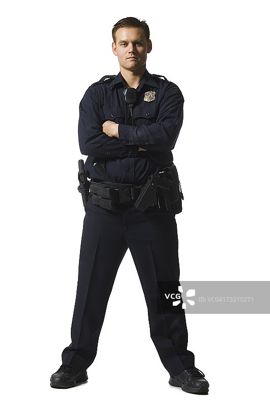 男警官双臂交叉站立图片素材