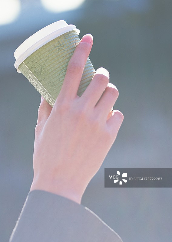 手持咖啡图片素材