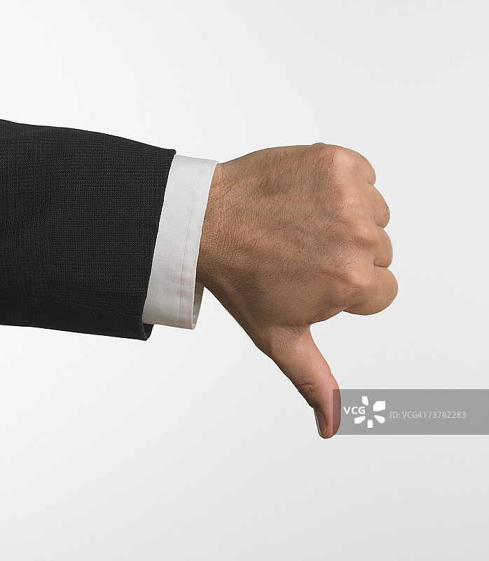 商人手势朝下影棚照图片素材
