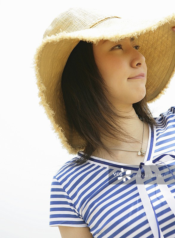 戴帽子的日本女人微笑图片素材