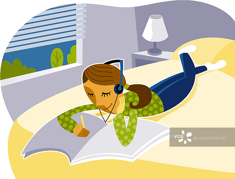 少女边听音乐边做作业图片素材