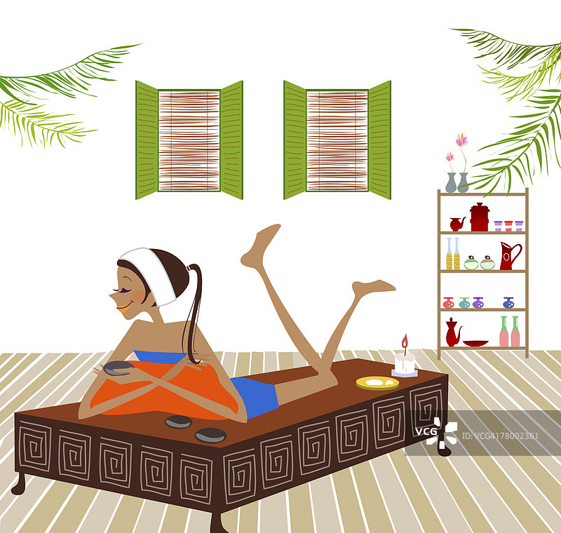 女人躺在床上，手持热石图片素材