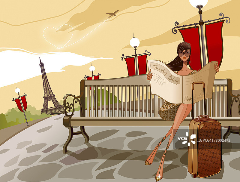 女人坐在法国巴黎的长椅上读报纸图片素材
