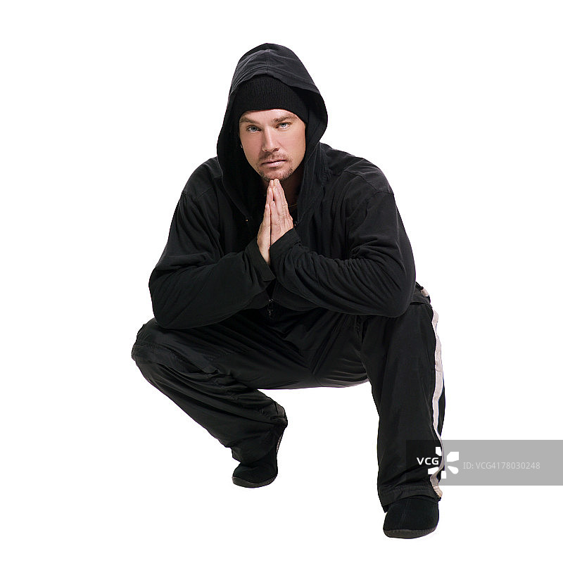 蹲在观众面前的歹徒剪影图片素材