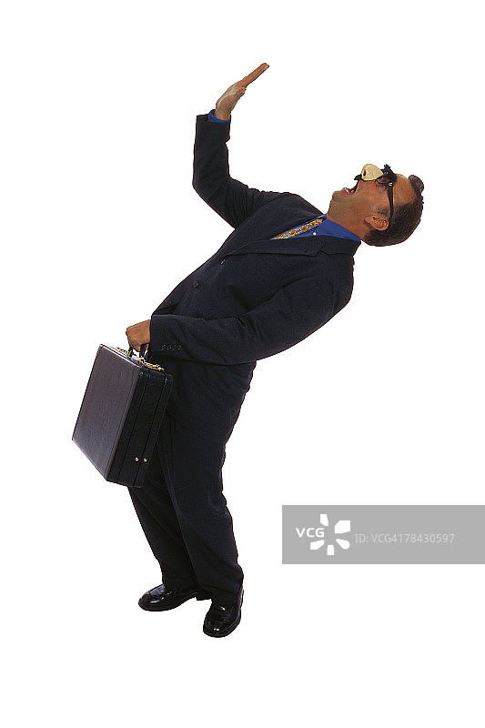 伪装的商人准备迎接坠落物体图片素材