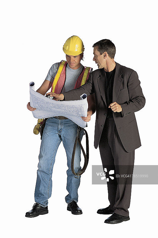 建筑工人和商人查看蓝图图片素材