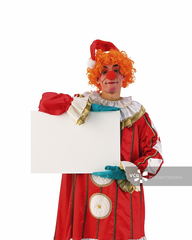 小丑拿着白板的正面肖像图片素材