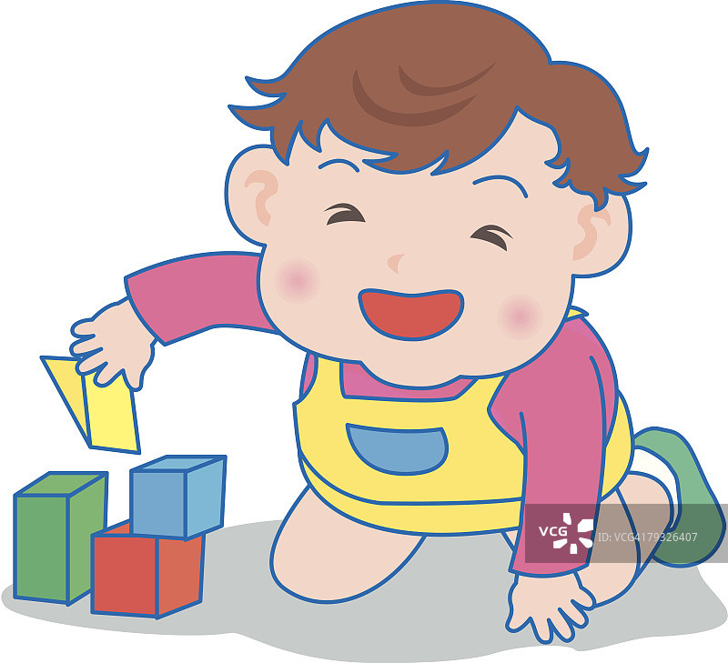 男孩玩积木，面带微笑图片素材