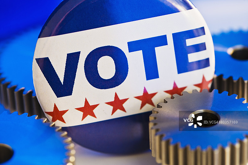 带齿轮的投票按钮特写图片素材