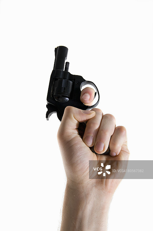 人手握持发令枪特写图片素材