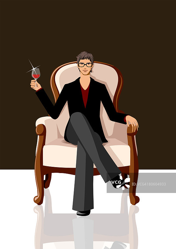 坐在扶手椅上拿着一杯红酒的男人图片素材