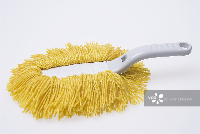 白色背景上的黄色掸子图片素材