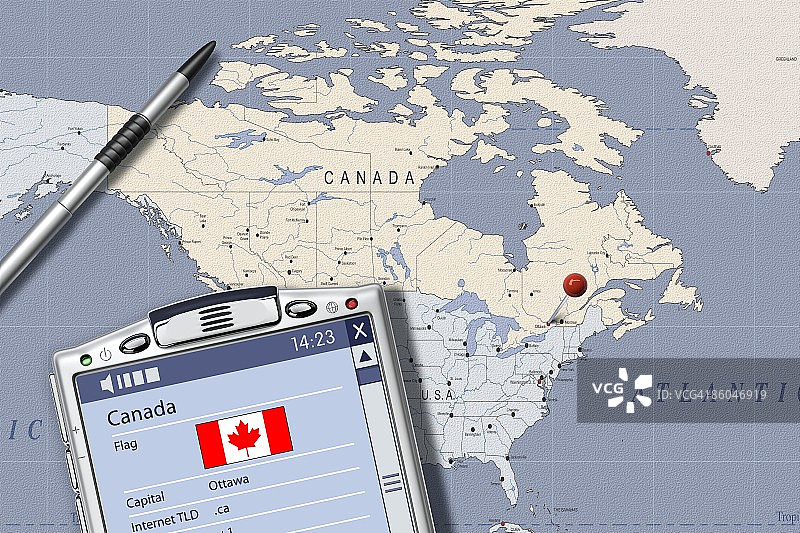 在显示信息的加拿大地图上的PDA图片素材