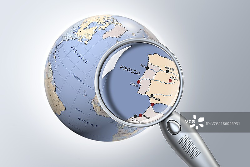 放大镜下地球仪上的葡萄牙特写图片素材