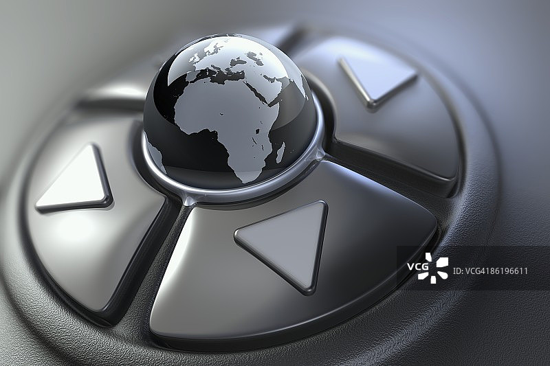位于游戏手柄方向键中心的地球仪图片素材