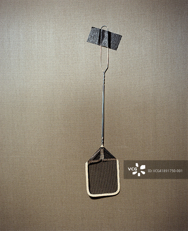 贴在墙上的苍蝇拍图片素材