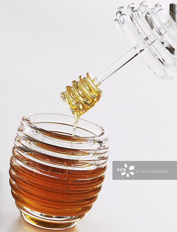 蜂蜜罐和蜂蜜勺图片素材