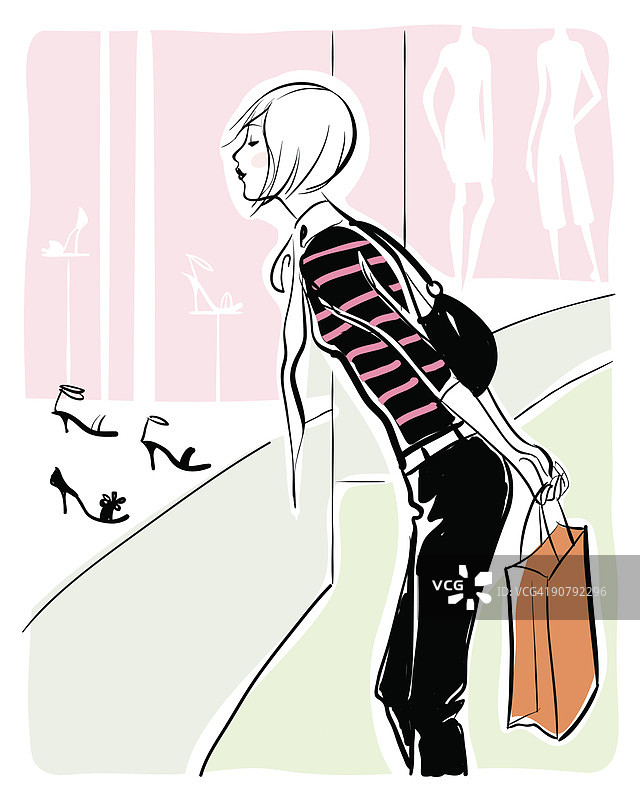 女人在零售店的橱窗里看鞋子图片素材