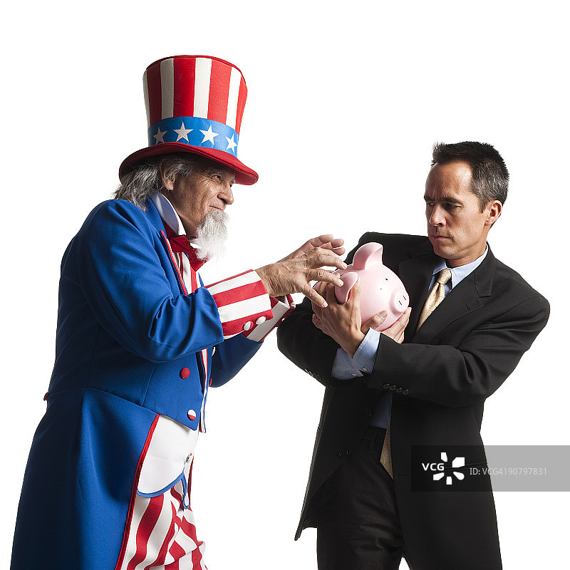 山姆大叔偷窃男人的储蓄罐图片素材