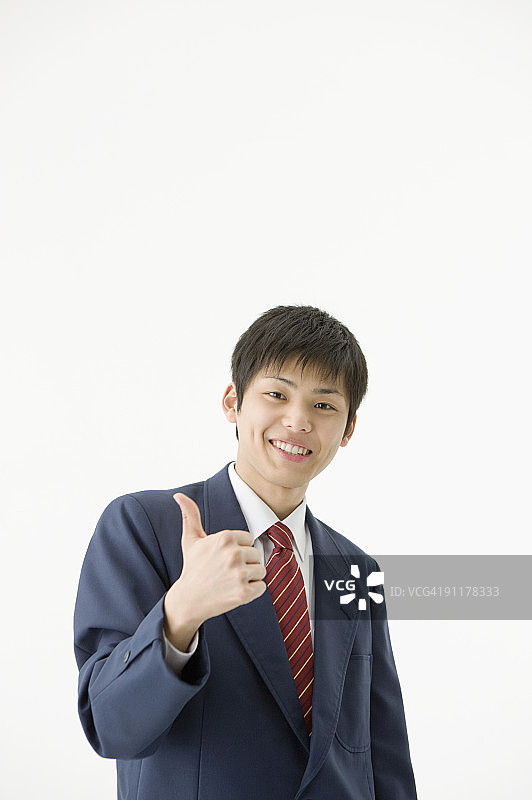高中生竖起大拇指，肖像照，工作室拍摄图片素材