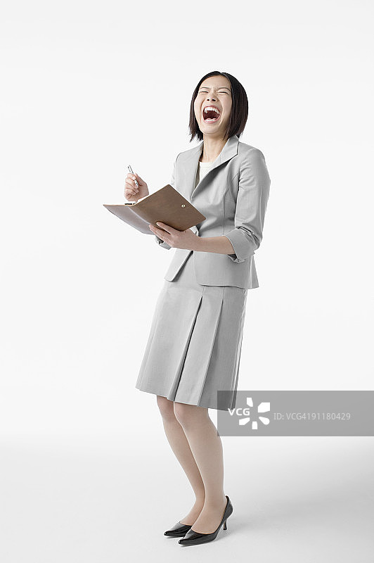 微笑的女商人，工作室拍摄图片素材