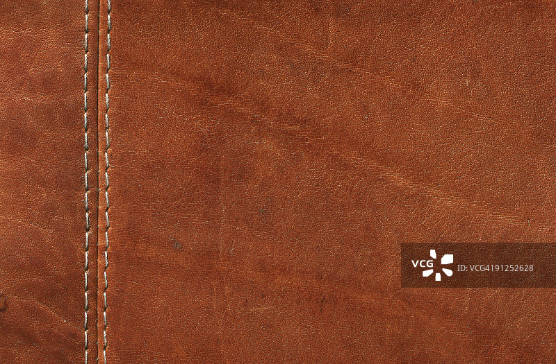 带针脚的棕色皮革特写图片素材