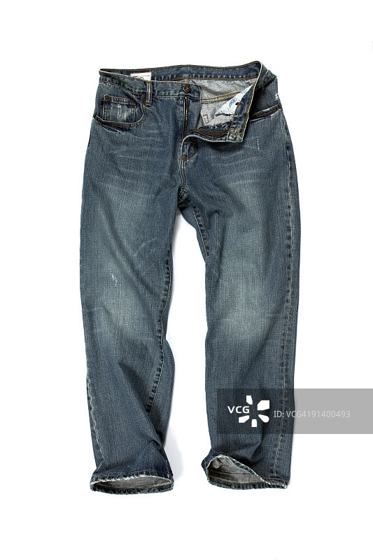 白色背景上的解扣蓝色牛仔裤图片素材