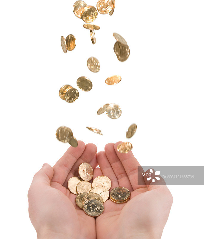 双手捧着掉落的金币图片素材