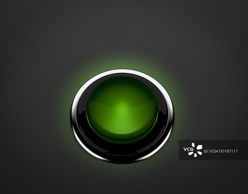 黑暗中发光的大型绿色按钮图片素材