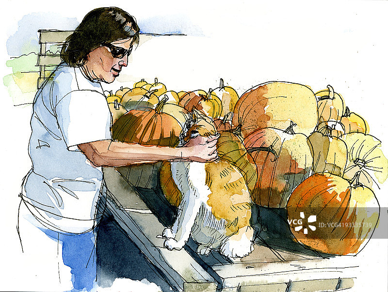 抱着猫和南瓜的女人图片素材