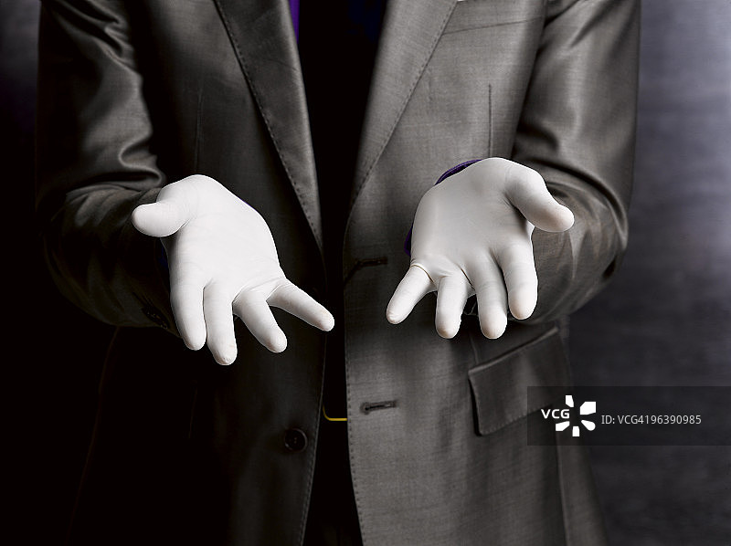 戴着橡胶手套的商人图片素材